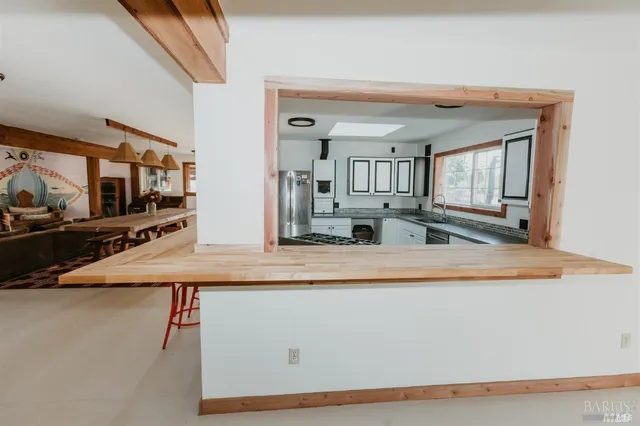 a view of a mountain in the distance in a field