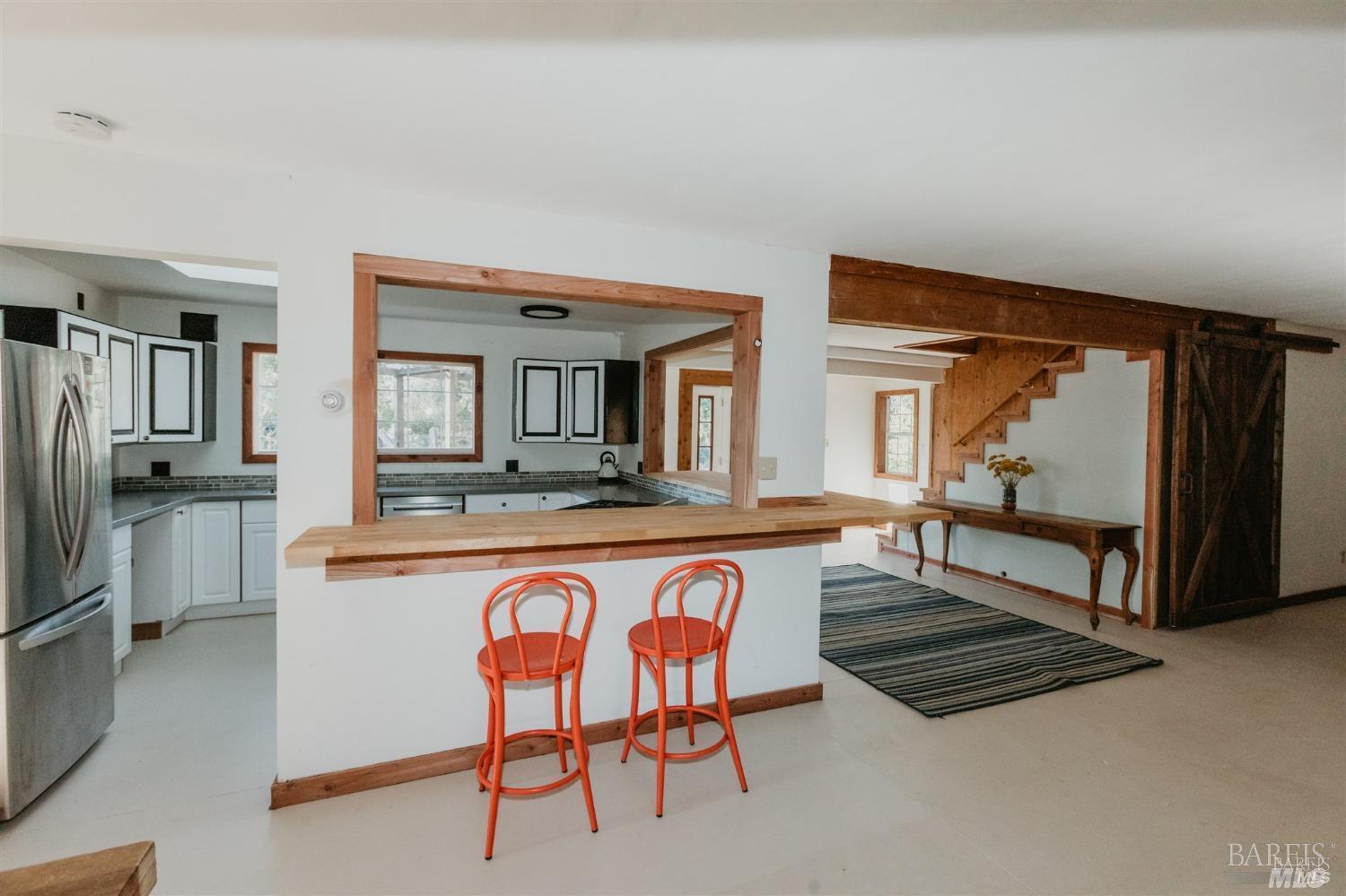49100 Wickersham Road Geyserville, CA 95441 - Photo 51 of 98 a living room with stainless steel appliances granite countertop furniture and a kitchen view