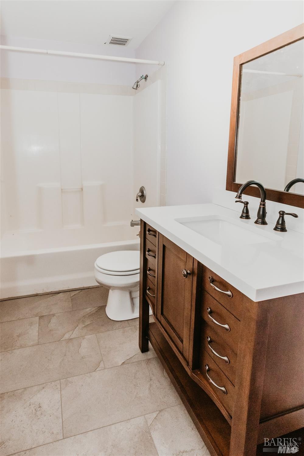 49100 Wickersham Road Geyserville, CA 95441 - Photo 72 of 98 a bathroom with a sink a toilet and a mirror