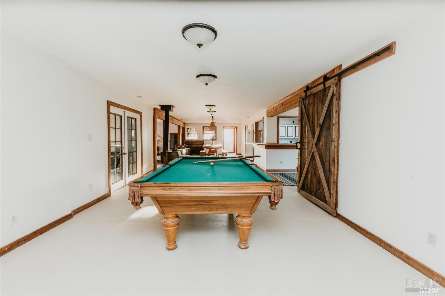 49100 Wickersham Road Geyserville, CA 95441 - Photo 73 of 98 a room with pool table windows and stairs