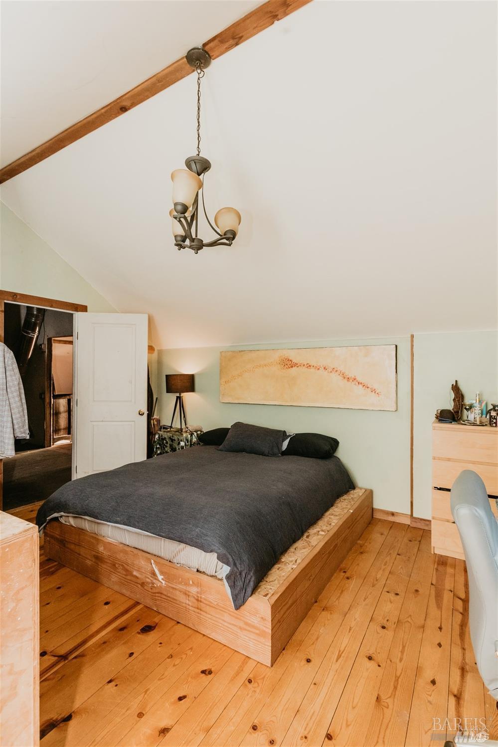 49100 Wickersham Road Geyserville, CA 95441 - Photo 77 of 98 a bedroom with a bed and painting on the wall