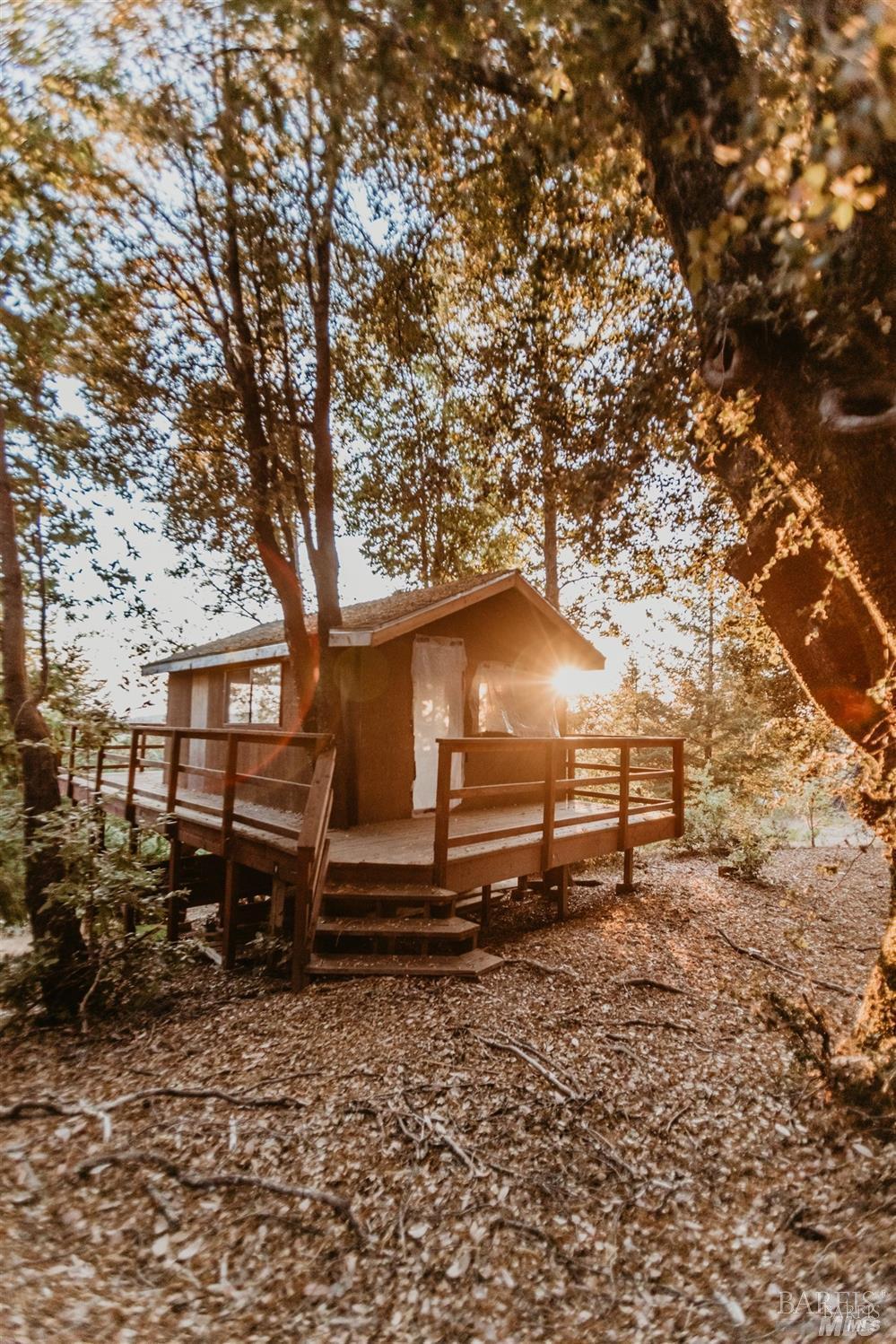 49100 Wickersham Road Geyserville, CA 95441 - Photo 82 of 98 a view of a wooden bench next to a yard