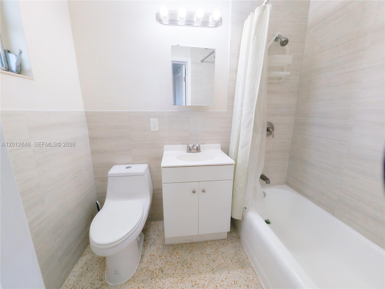1220 Southwest 5th Street, Unit 16 Miami, FL 33135 - Photo 7 of 8 a bathroom with a sink toilet and bathtub