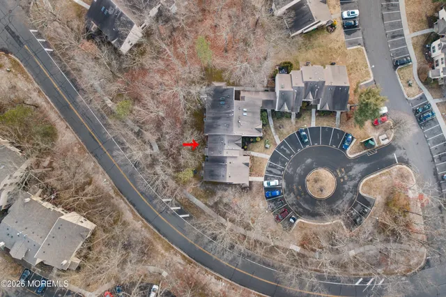 an aerial view of a house with a backyard