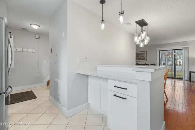 a bathroom with a sink a mirror and a shower