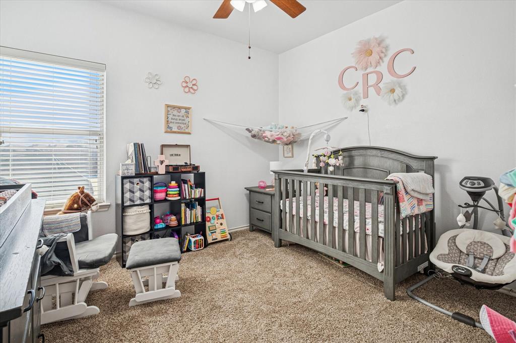 111 Freedom Trail Forney, TX 75126 - Photo 12 of 16 a view of a room with furniture and a chandelier