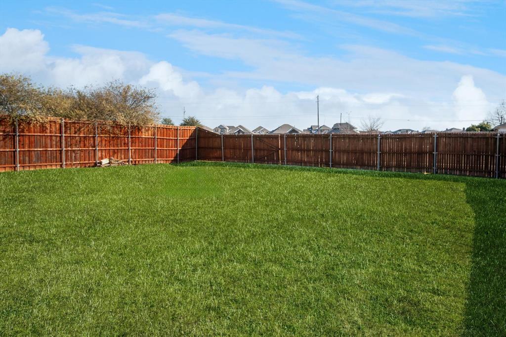 111 Freedom Trail Forney, TX 75126 - Photo 16 of 16 a view of a backyard