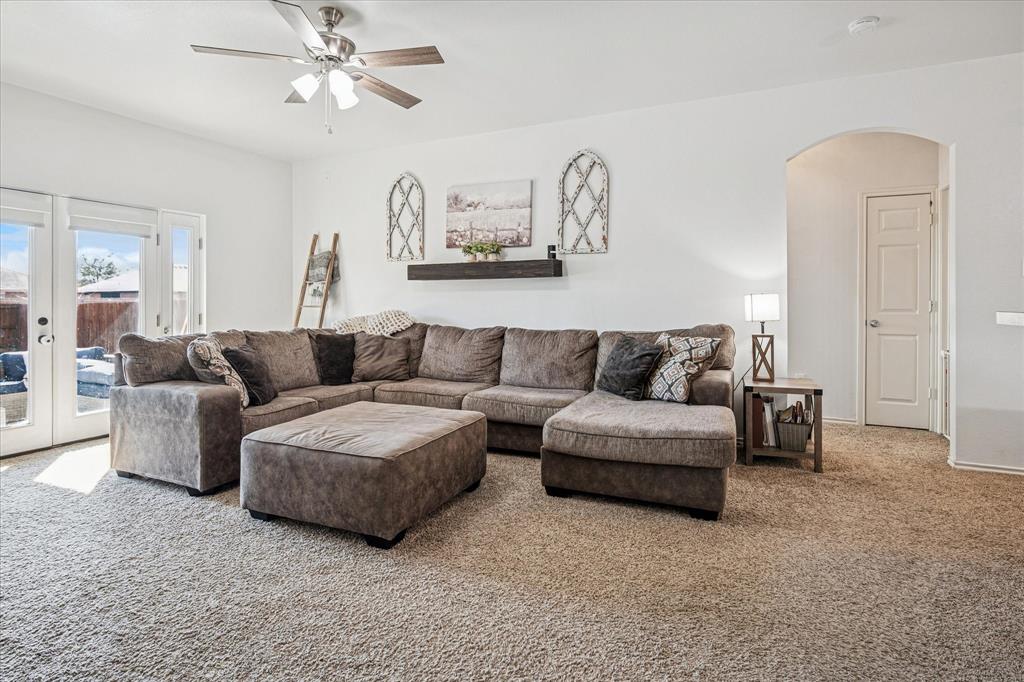 111 Freedom Trail Forney, TX 75126 - Photo 3 of 16 a living room with furniture and a ceiling fan