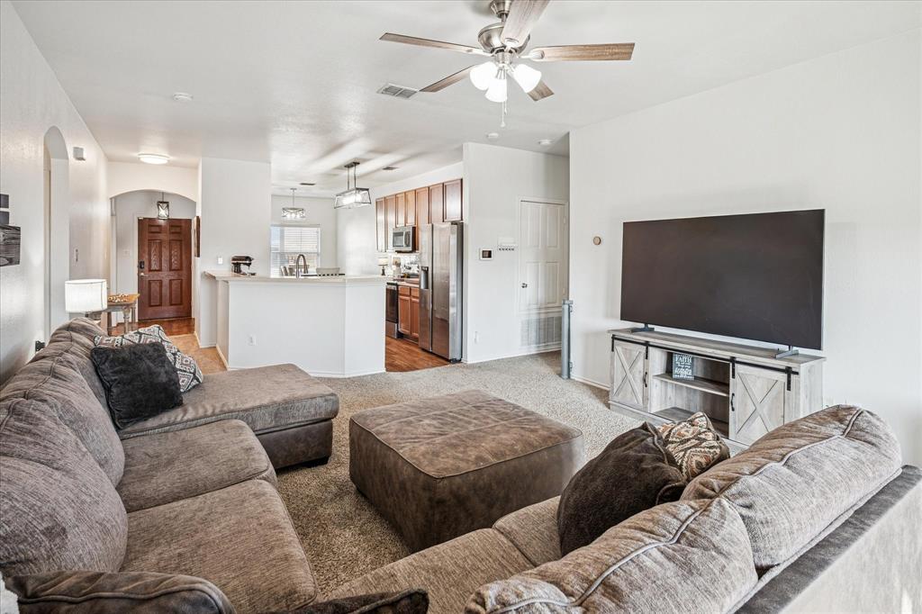 111 Freedom Trail Forney, TX 75126 - Photo 4 of 16 a living room with furniture and a flat screen tv