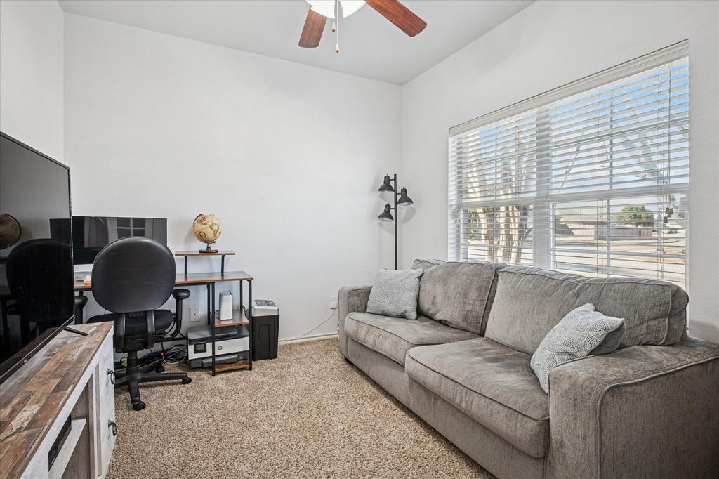 111 Freedom Trail Forney, TX 75126 - Photo 7 of 16 a living room with furniture and a window