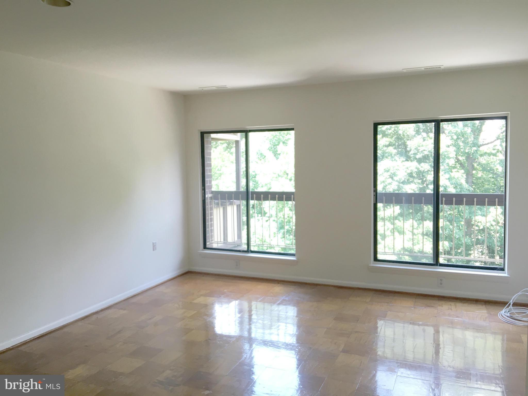 200 Cross Keys Road, Unit R65 Baltimore, MD 21210 - Photo 2 of 9 an empty room with windows