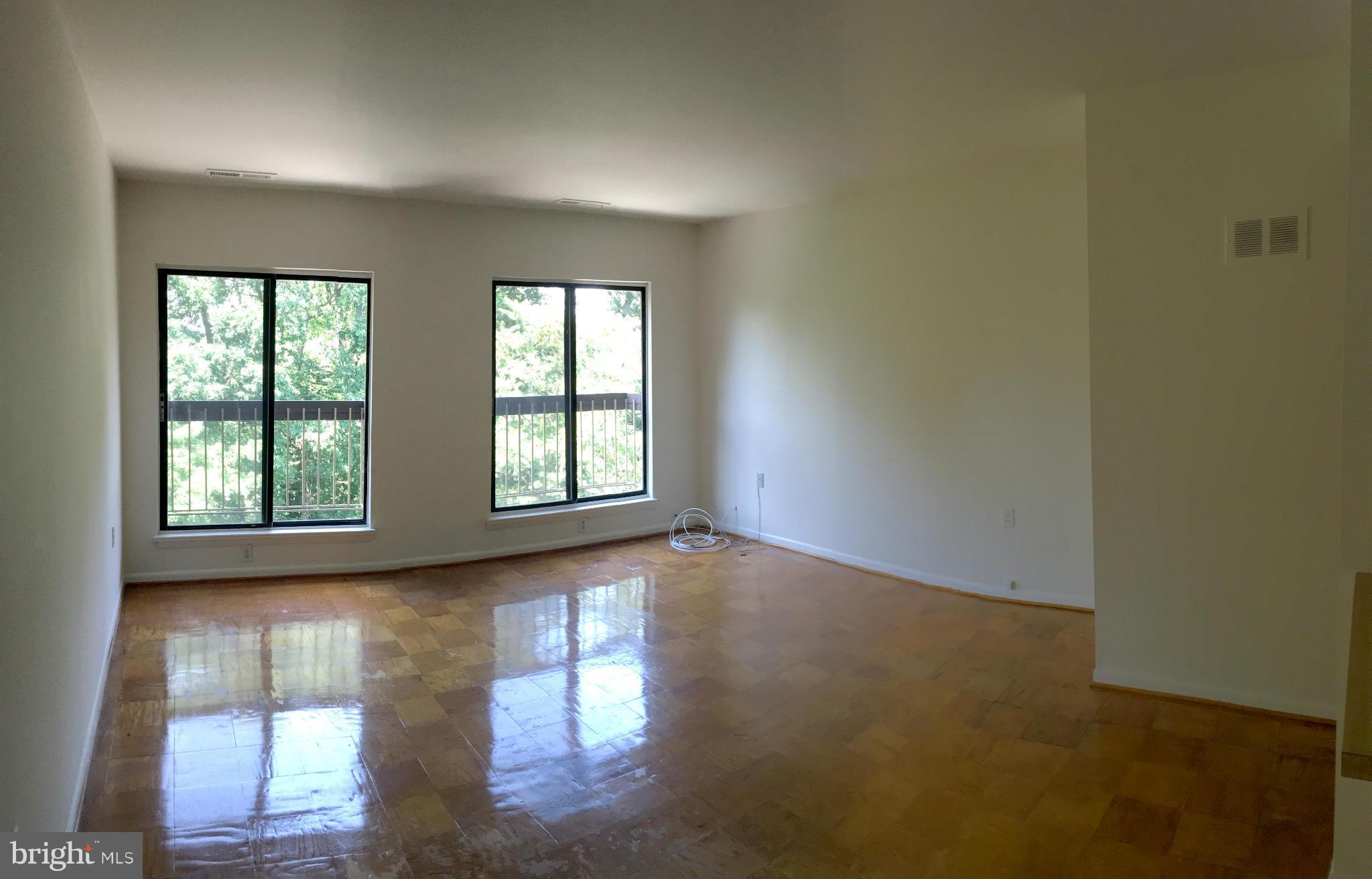 200 Cross Keys Road, Unit R65 Baltimore, MD 21210 - Photo 3 of 9 an empty room with windows