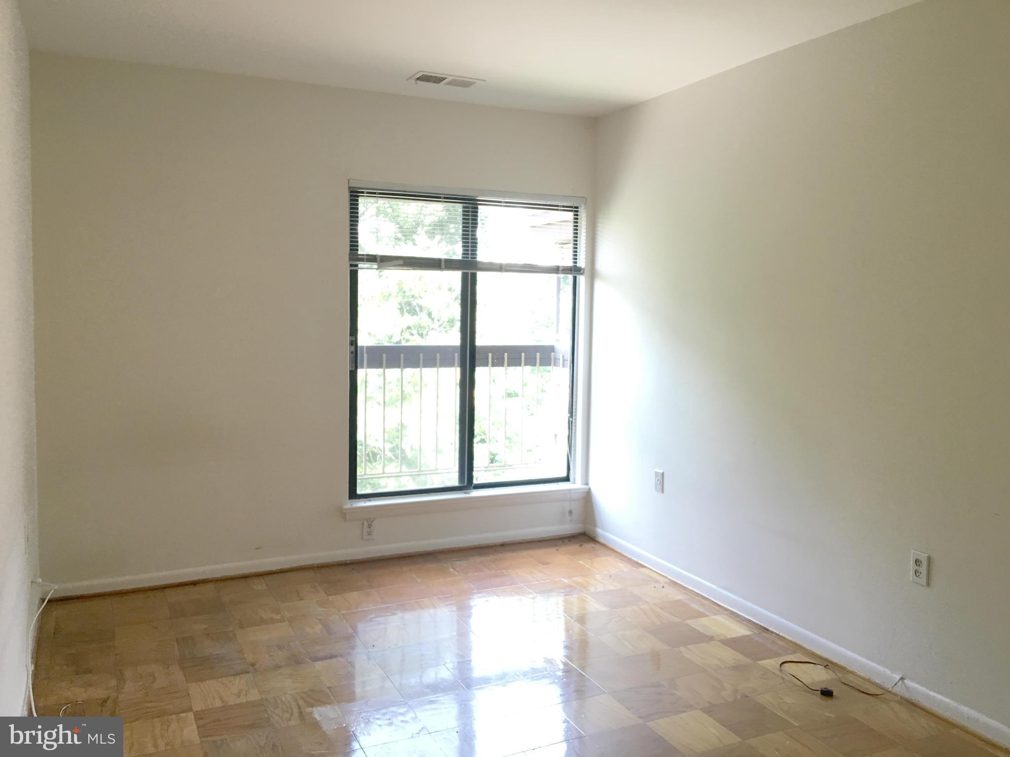 200 Cross Keys Road, Unit R65 Baltimore, MD 21210 - Photo 7 of 9 an empty room with windows