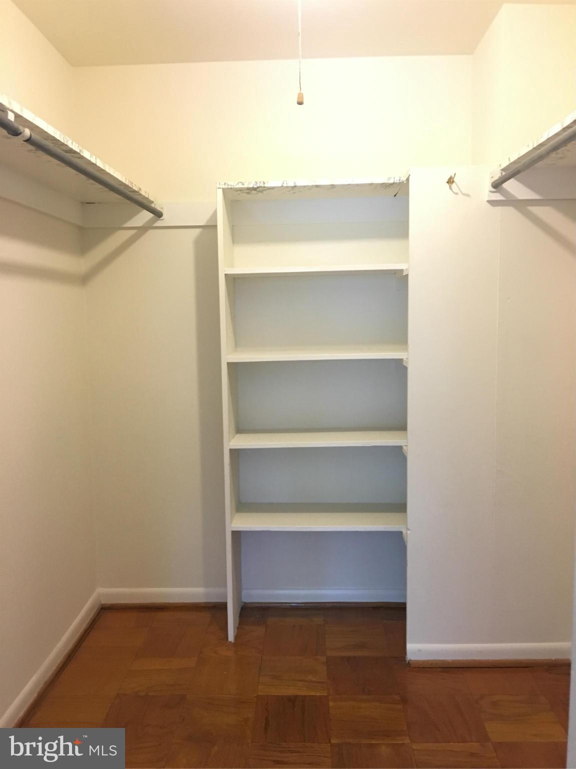 200 Cross Keys Road, Unit R65 Baltimore, MD 21210 - Photo 8 of 9 a view of walk in closet with empty racks