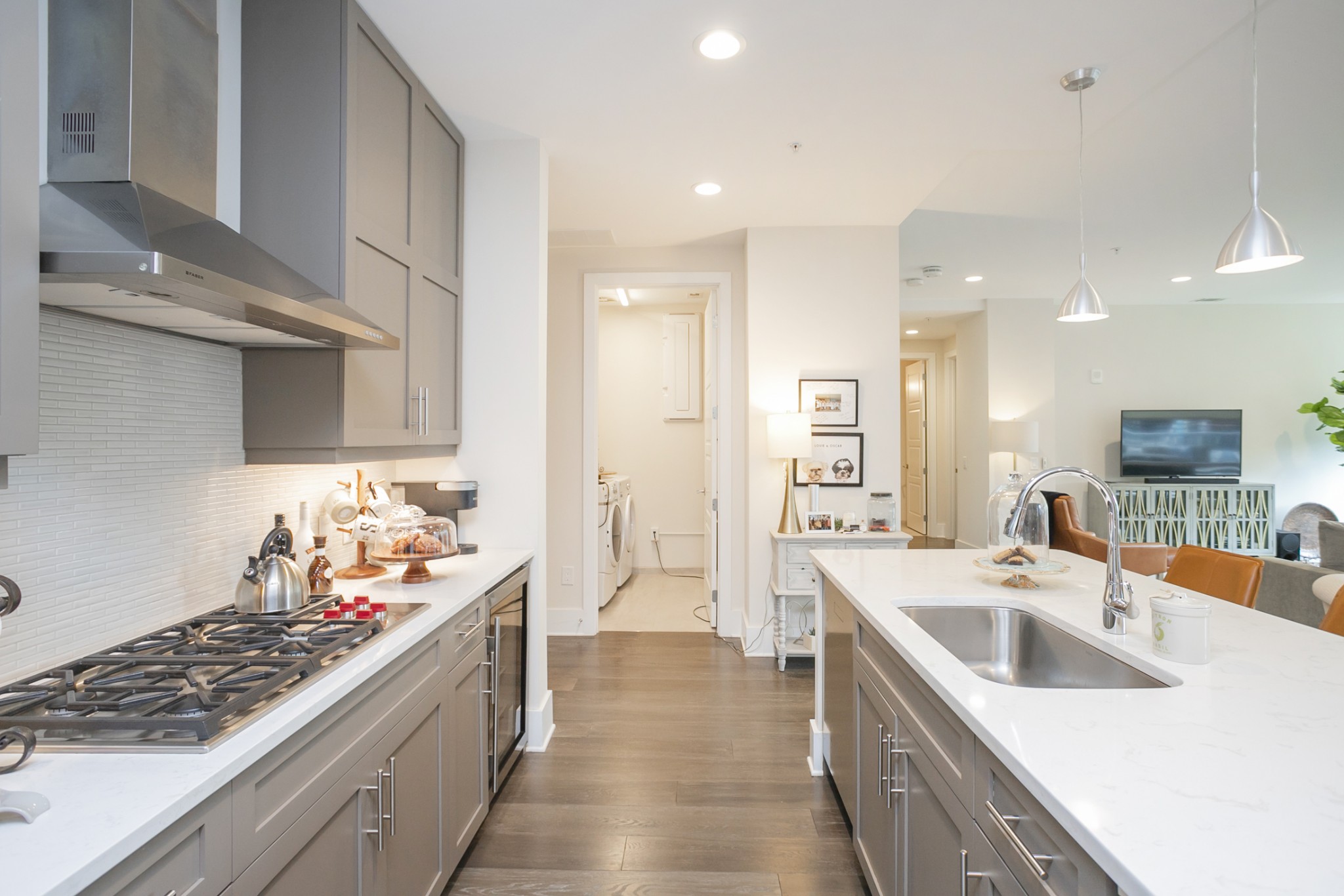 20 Rutledge Street, Unit 104 Nashville, TN 37210 - Photo 12 of 35 a kitchen with stainless steel appliances a sink stove and cabinets