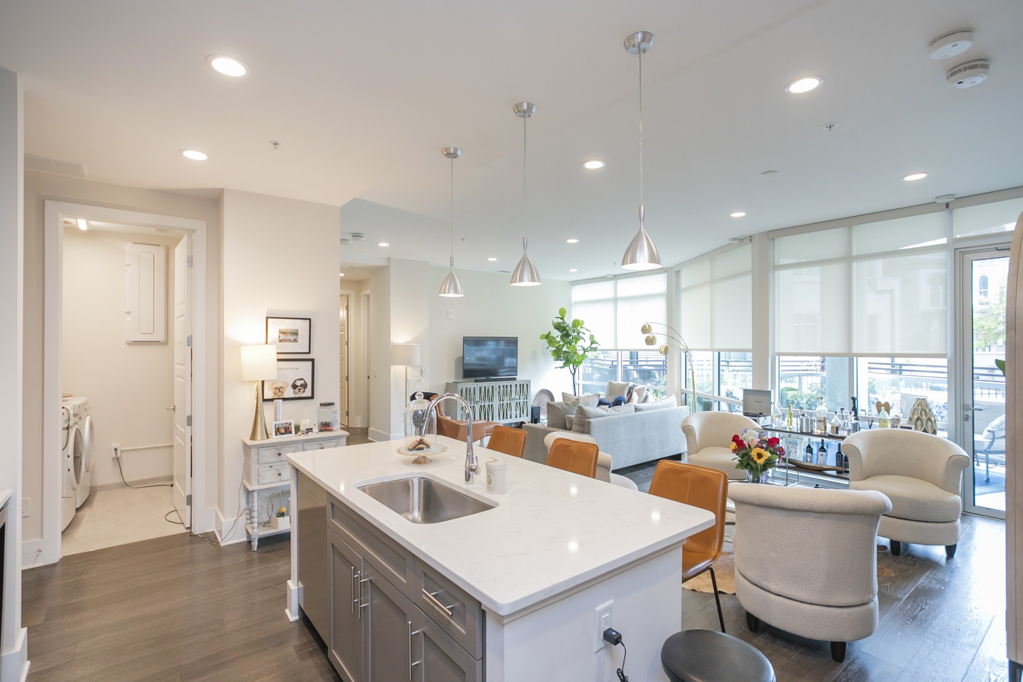 20 Rutledge Street, Unit 104 Nashville, TN 37210 - Photo 13 of 35 a open dining room with stainless steel appliances kitchen island granite countertop a sink and a refrigerator