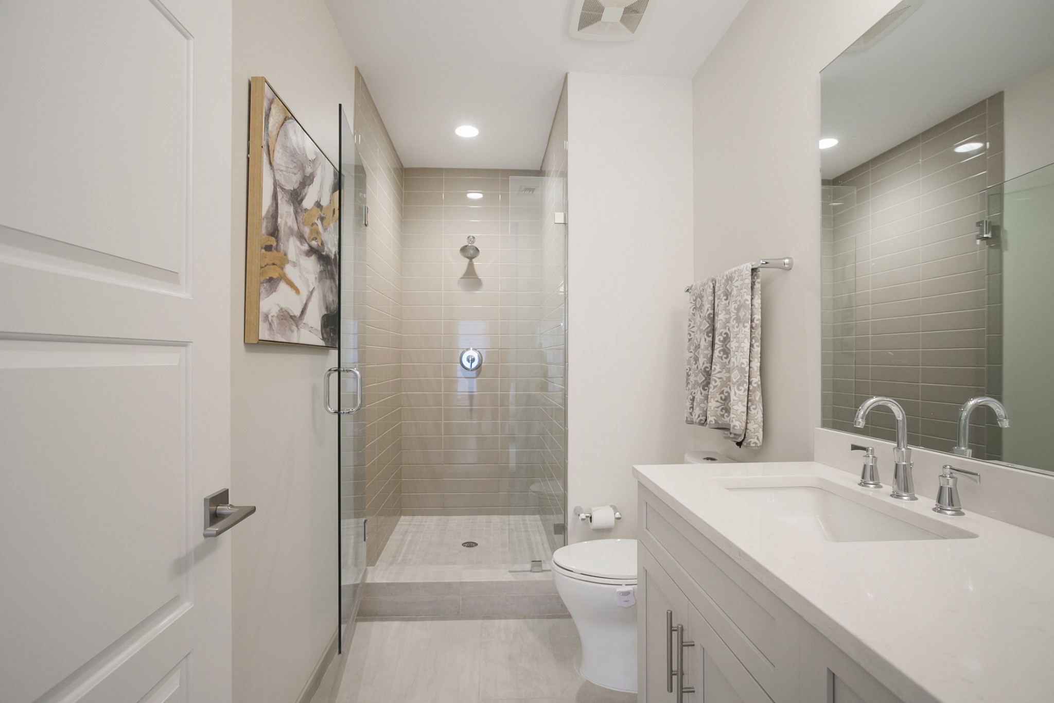 20 Rutledge Street, Unit 104 Nashville, TN 37210 - Photo 17 of 35 a bathroom with a sink a toilet and shower