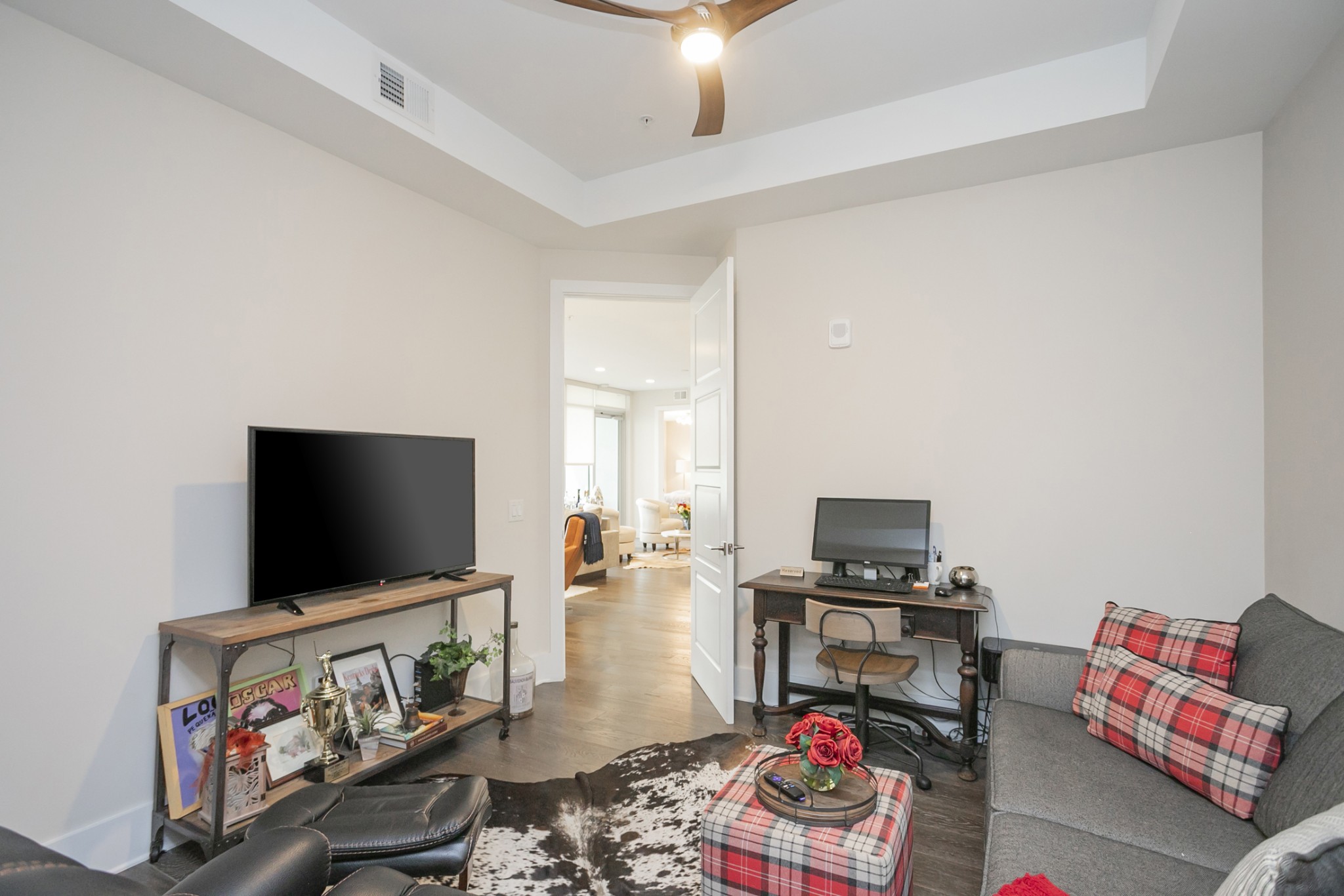 20 Rutledge Street, Unit 104 Nashville, TN 37210 - Photo 18 of 35 a living room with furniture and a flat screen tv