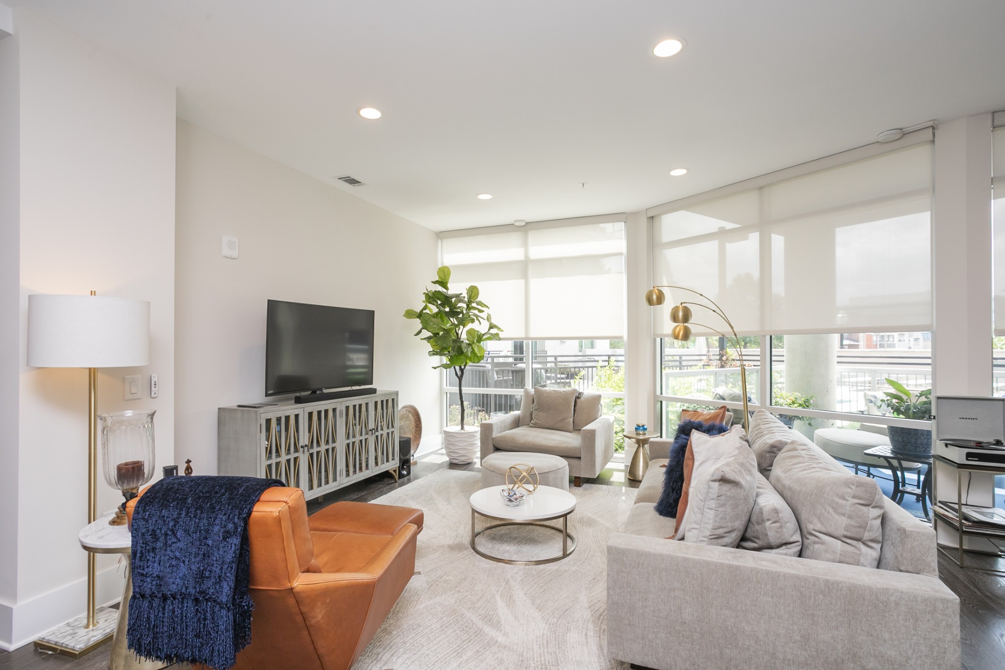 20 Rutledge Street, Unit 104 Nashville, TN 37210 - Photo 26 of 35 a living room with furniture and a flat screen tv