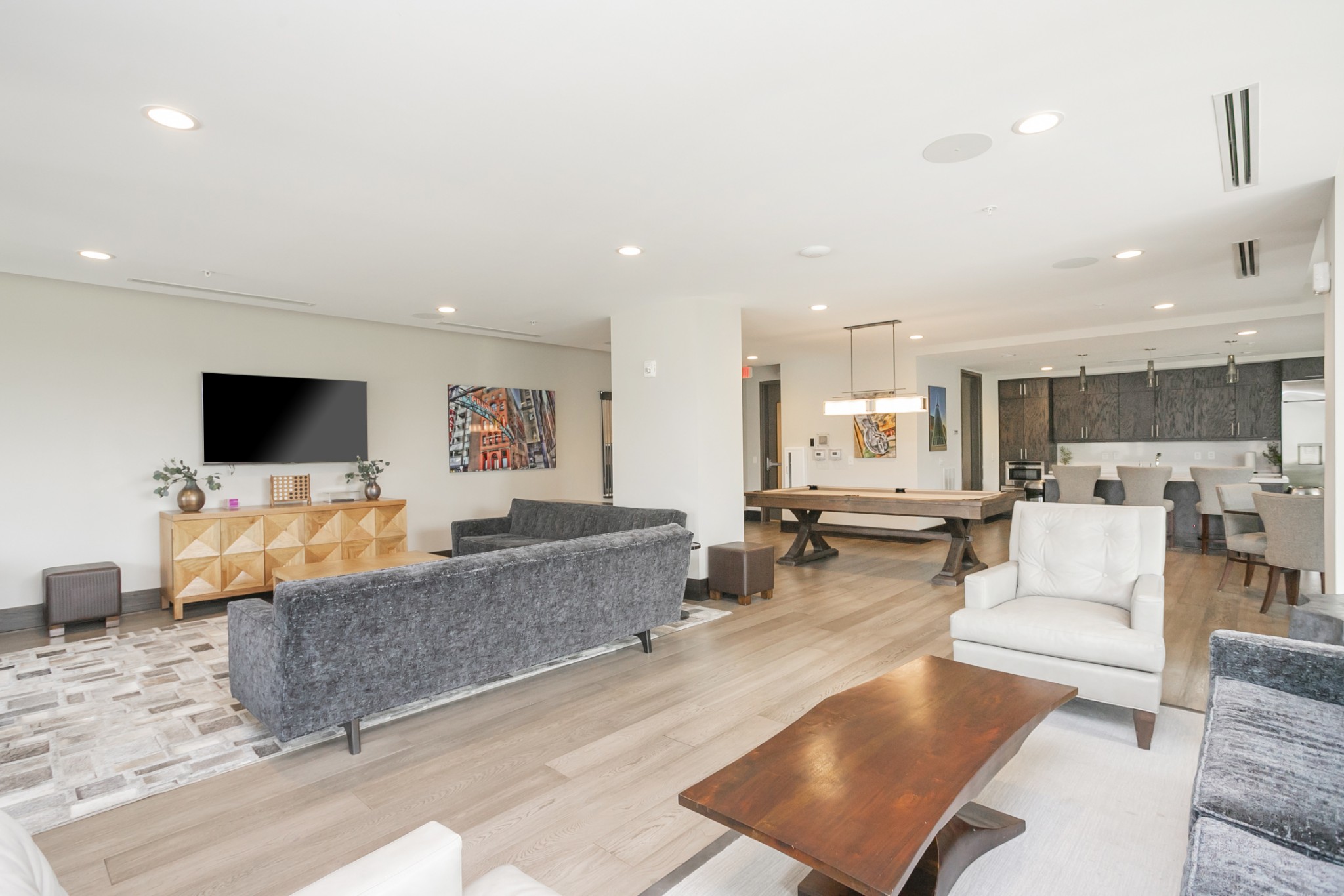 20 Rutledge Street, Unit 104 Nashville, TN 37210 - Photo 34 of 35 a living room with furniture and a flat screen tv
