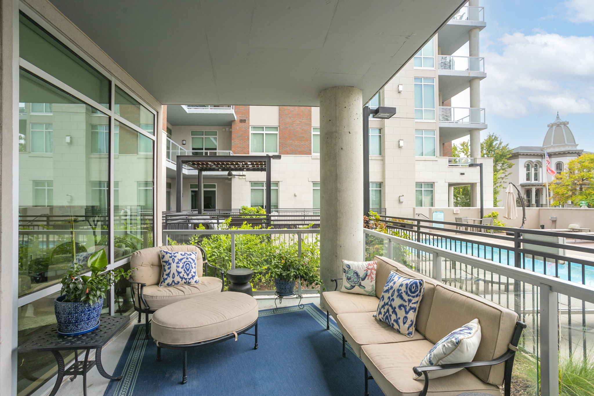 20 Rutledge Street, Unit 104 Nashville, TN 37210 - Photo 5 of 35 a balcony with furniture and a potted plant