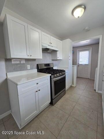 2417 Delaware Drive Melbourne, FL 32935 - Photo 4 of 16 a kitchen with cabinets and white appliances