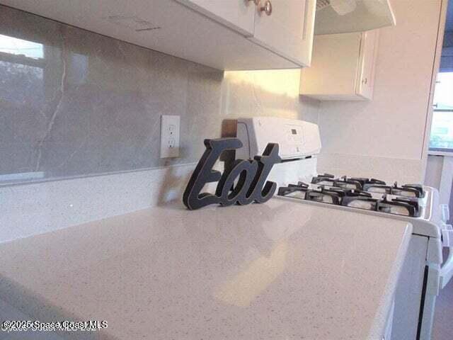 2417 Delaware Drive Melbourne, FL 32935 - Photo 6 of 16 a room with furniture a window and a potted plant