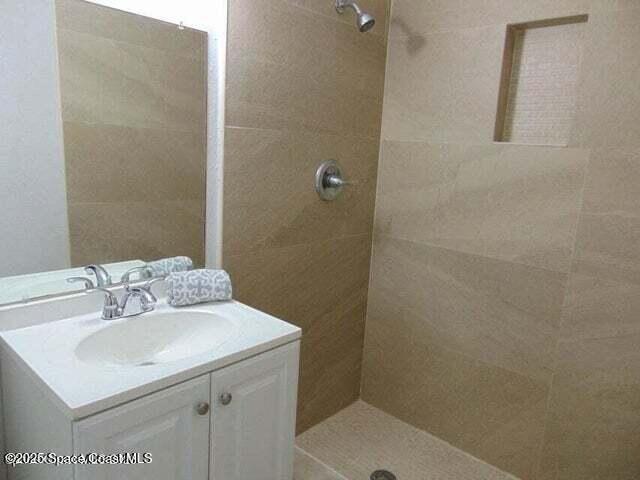 2417 Delaware Drive Melbourne, FL 32935 - Photo 10 of 16 a bathroom with a sink toilet and vanity