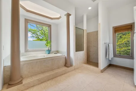 a bathroom with a bathtub and a shower
