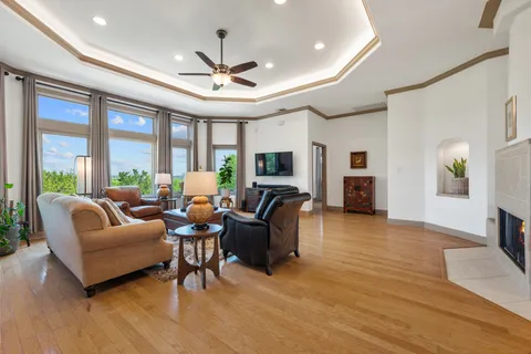 a living room with furniture and a large window