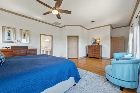 a spacious bedroom with a bed and furniture