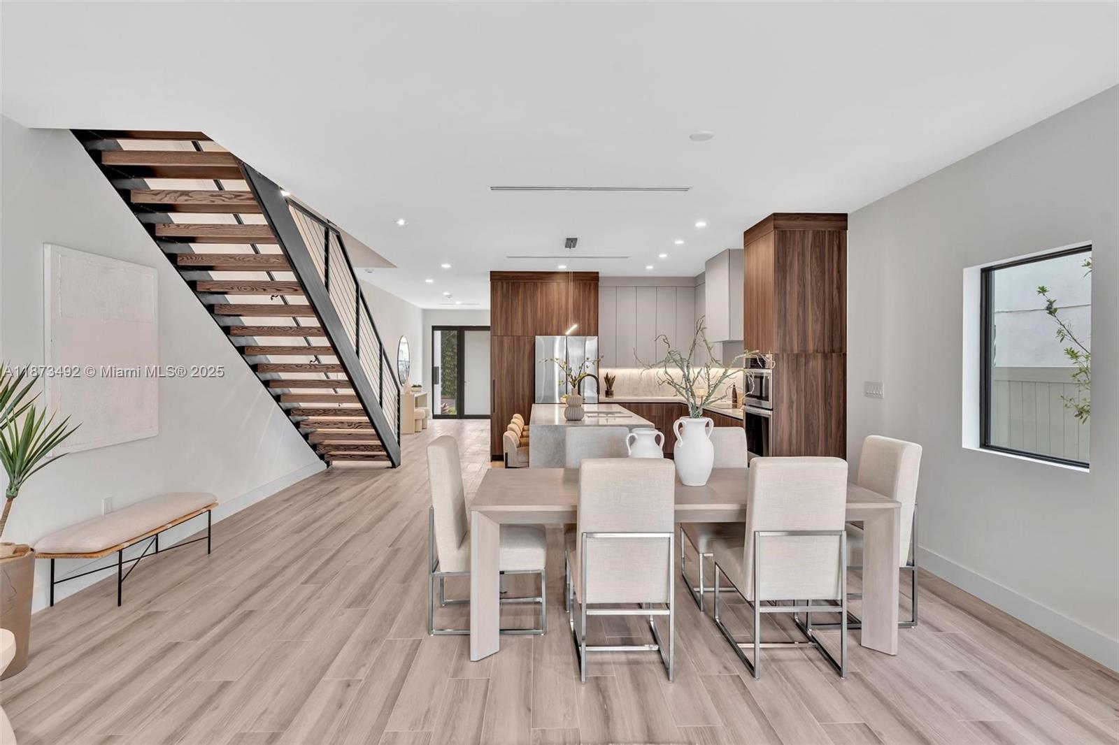 1387 Southwest 22nd Terrace Miami, FL 33145 - Photo 22 of 59 a view of a dining room with furniture and wooden floor
