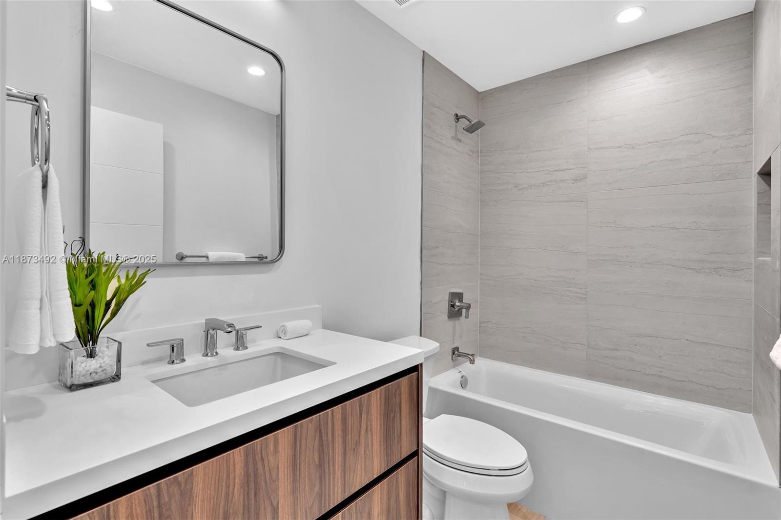 1387 Southwest 22nd Terrace Miami, FL 33145 - Photo 36 of 59 a bathroom with a sink a toilet and shower