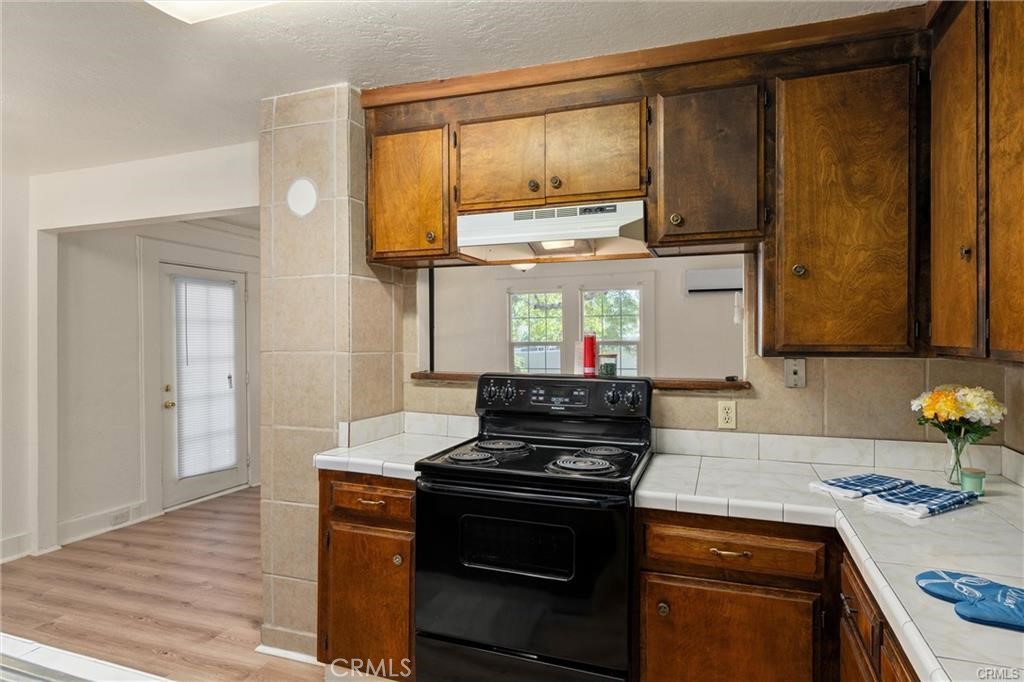 1220 Long Bar Road Oroville, CA 95966 - Photo 11 of 30 a kitchen with stainless steel appliances granite countertop a stove and a microwave