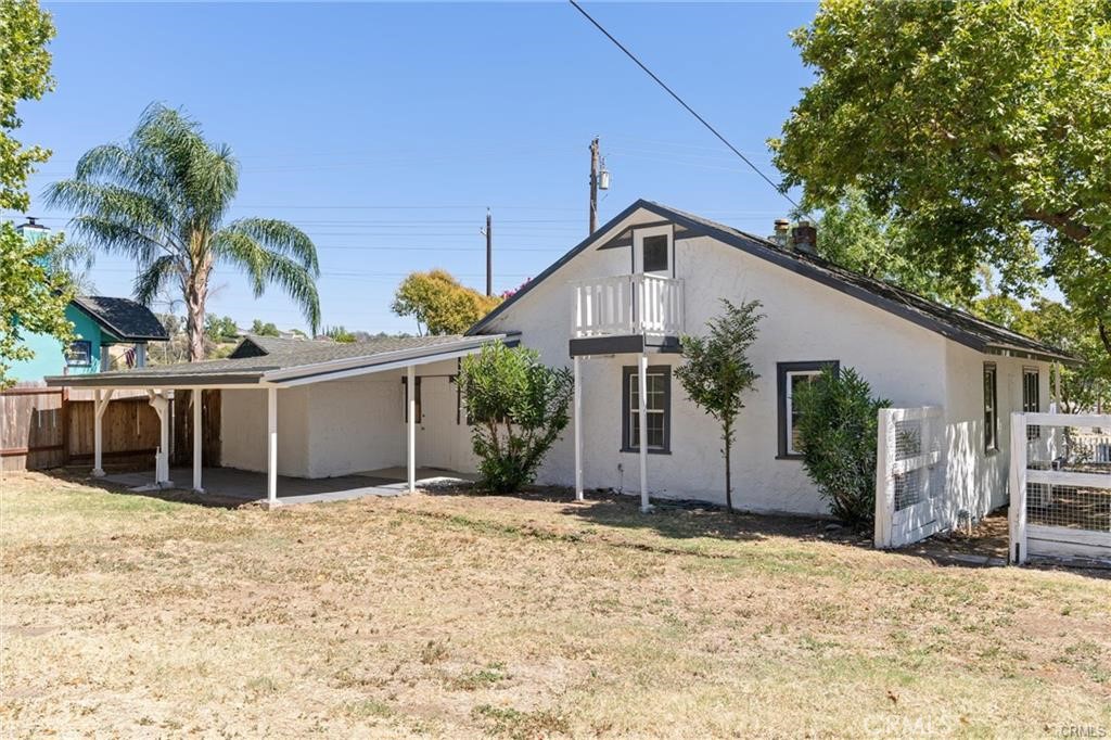 1220 Long Bar Road Oroville, CA 95966 - Photo 24 of 30 a view of a house with a yard and potted plants