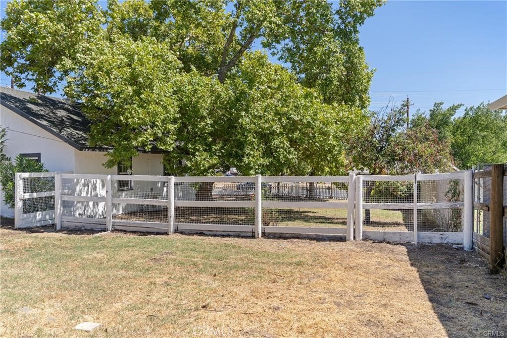 1220 Long Bar Road Oroville, CA 95966 - Photo 30 of 30 a wooden fence and trees in the background