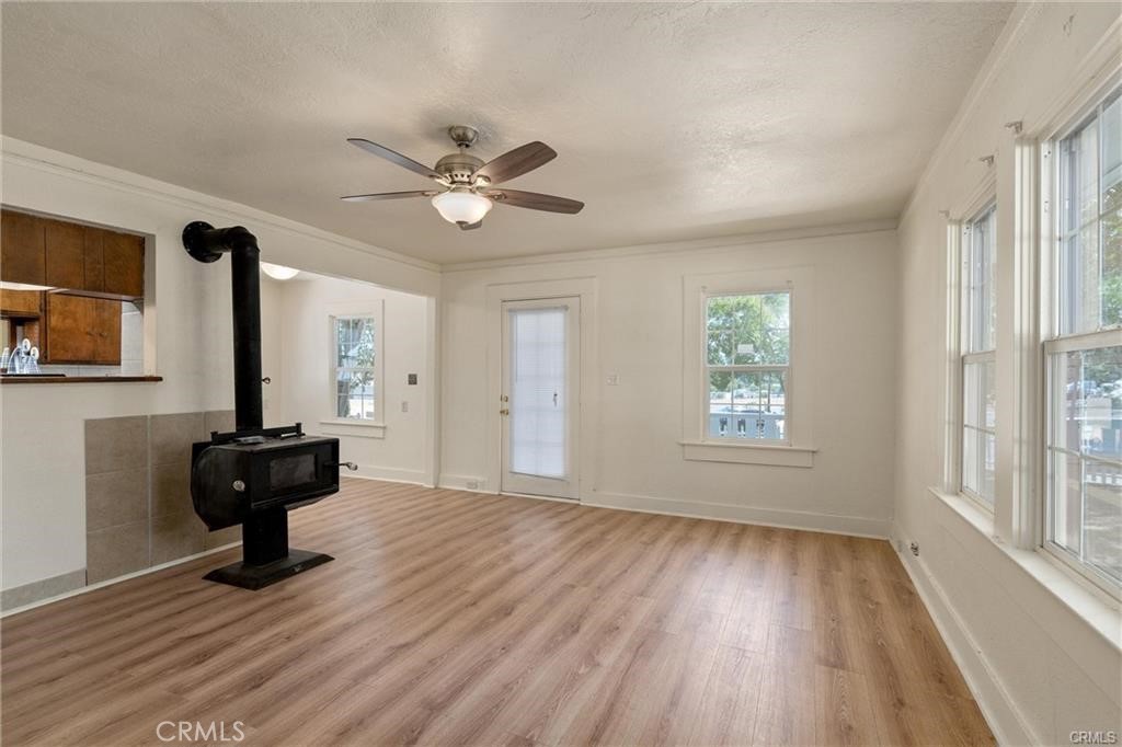 1220 Long Bar Road Oroville, CA 95966 - Photo 9 of 30 a view of a livingroom with a hardwood floor and a ceiling fan