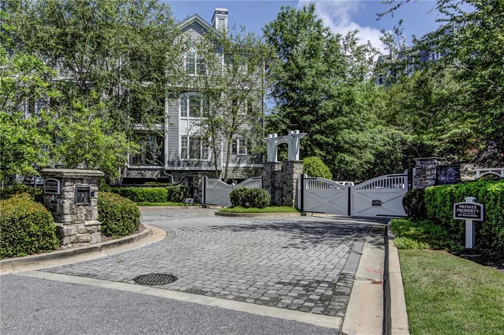 4100 Paces Walk Southeast, Unit 3205 Atlanta, GA 30339 - Photo 1 of 17 front view of a house with a yard