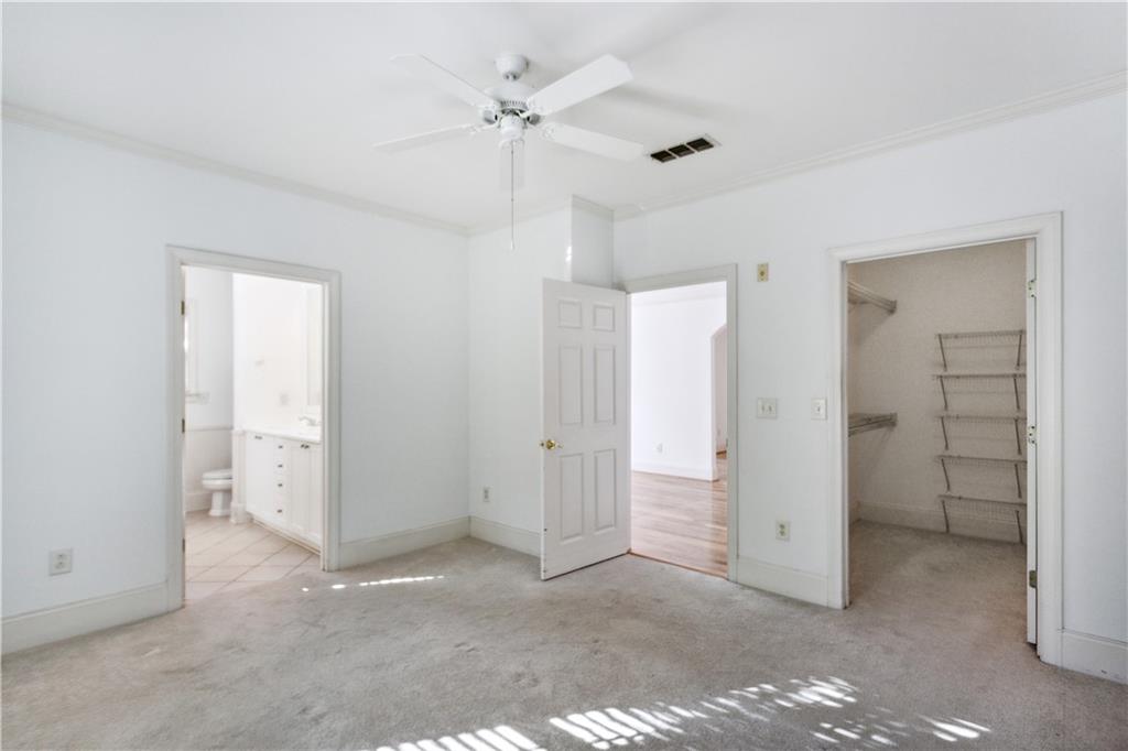 4100 Paces Walk Southeast, Unit 3205 Atlanta, GA 30339 - Photo 12 of 17 a view of a big room with closet and chandelier fan