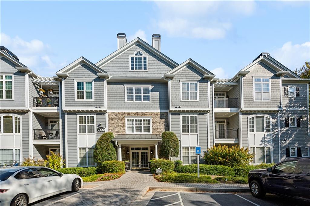 4100 Paces Walk Southeast, Unit 3205 Atlanta, GA 30339 - Photo 3 of 17 a view of multiple houses with a street