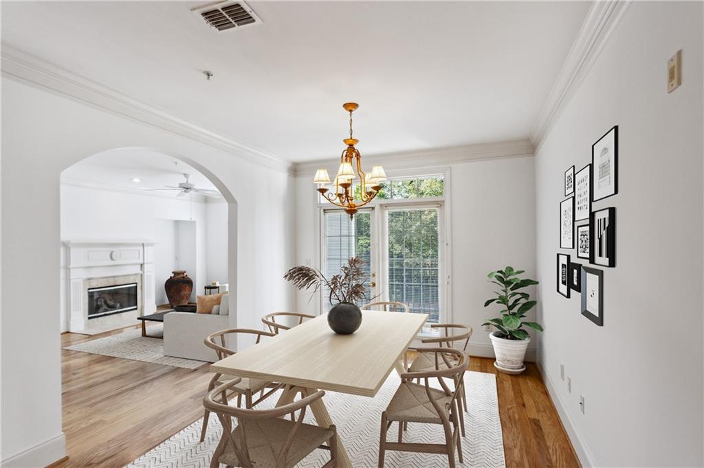 4100 Paces Walk Southeast, Unit 3205 Atlanta, GA 30339 - Photo 5 of 17 a view of a dining room with furniture window and wooden floor
