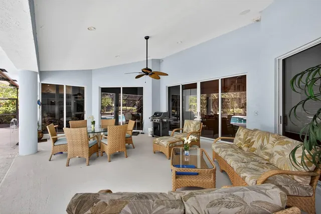 a kitchen with granite countertop a sink stainless steel appliances and cabinets