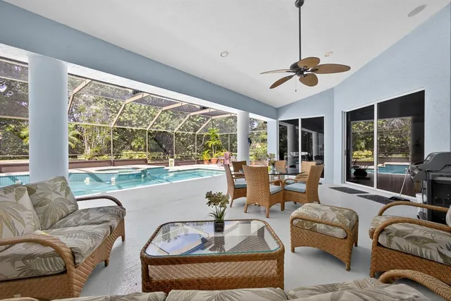 a living room with furniture and white walls