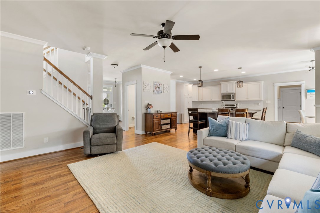 3230 Canford Loop Midlothian, VA 23112 - Photo 11 of 41 a living room with furniture kitchen view and a wooden floor