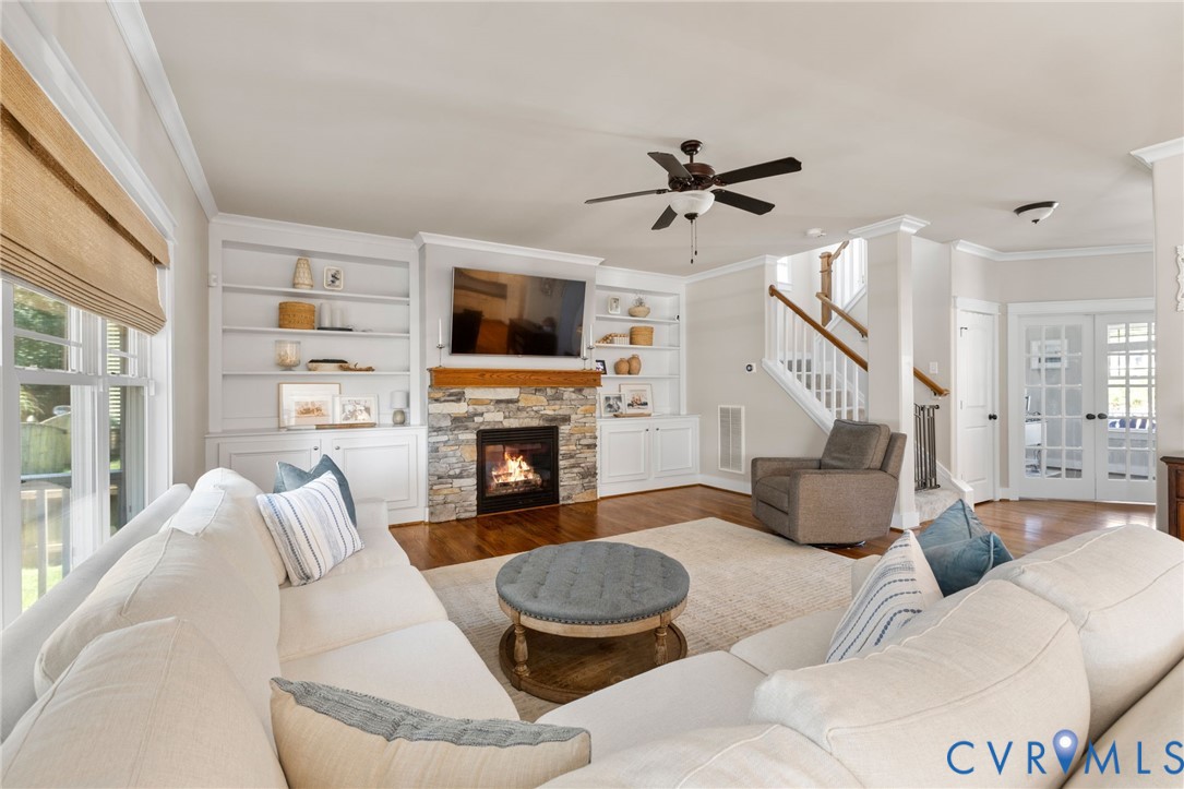 3230 Canford Loop Midlothian, VA 23112 - Photo 12 of 41 a living room with furniture fireplace and a flat screen tv