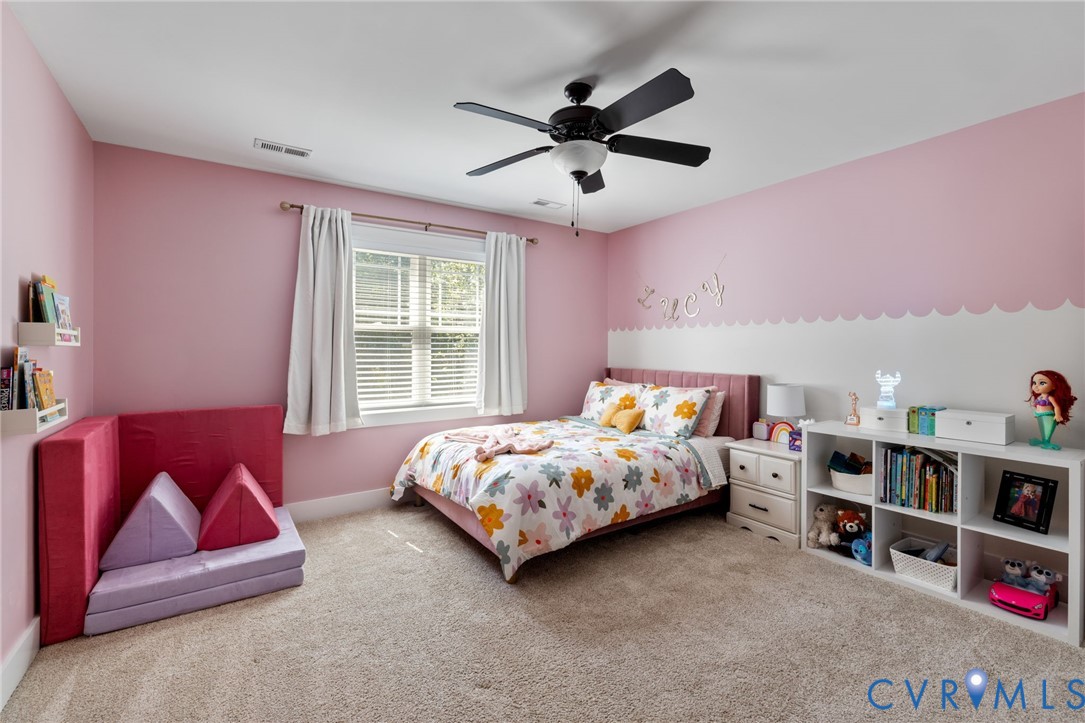 3230 Canford Loop Midlothian, VA 23112 - Photo 20 of 41 a bedroom with bed and a book shelf