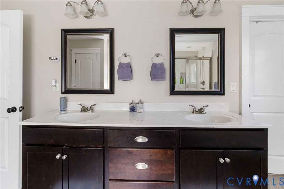 3230 Canford Loop Midlothian, VA 23112 - Photo 27 of 41 a bathroom with a double vanity sink and mirror