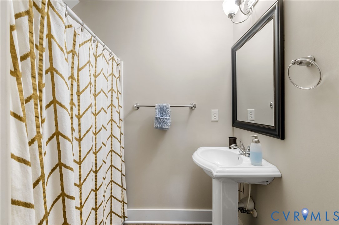 3230 Canford Loop Midlothian, VA 23112 - Photo 31 of 41 a bathroom with a sink and mirror