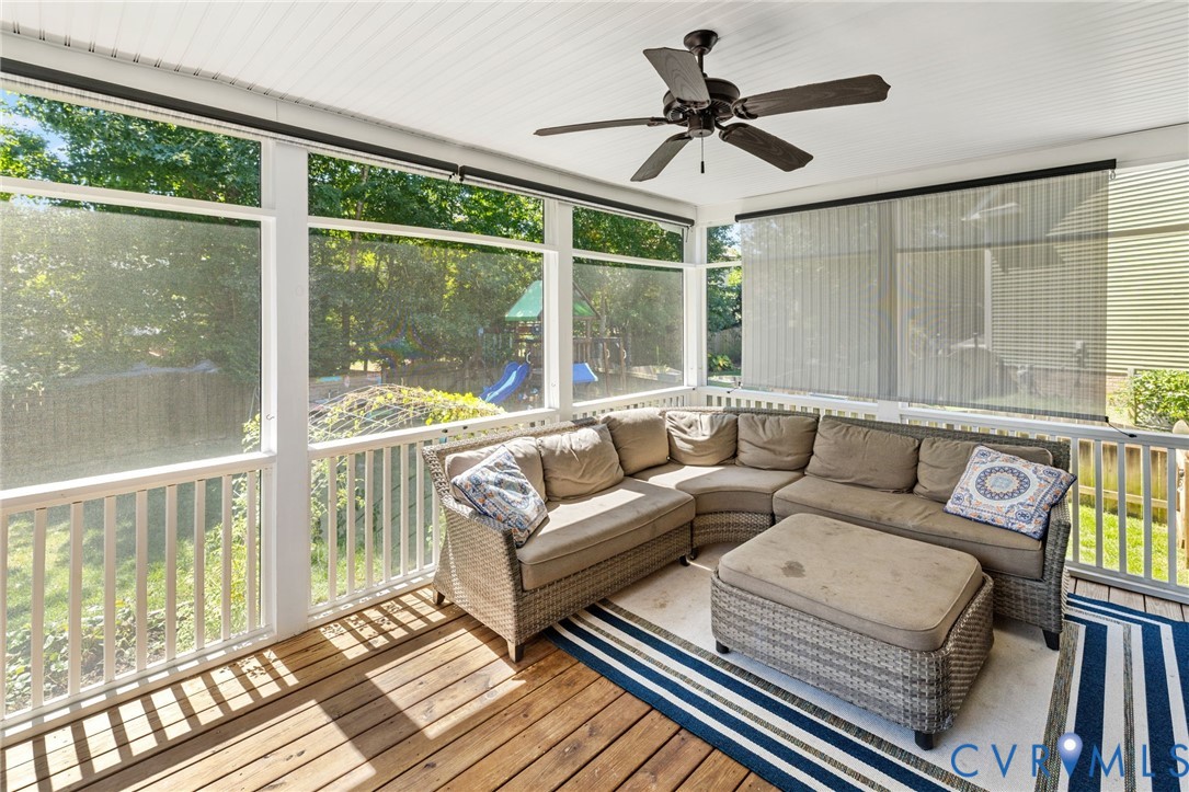 3230 Canford Loop Midlothian, VA 23112 - Photo 33 of 41 a living room with furniture and a large window with garden view