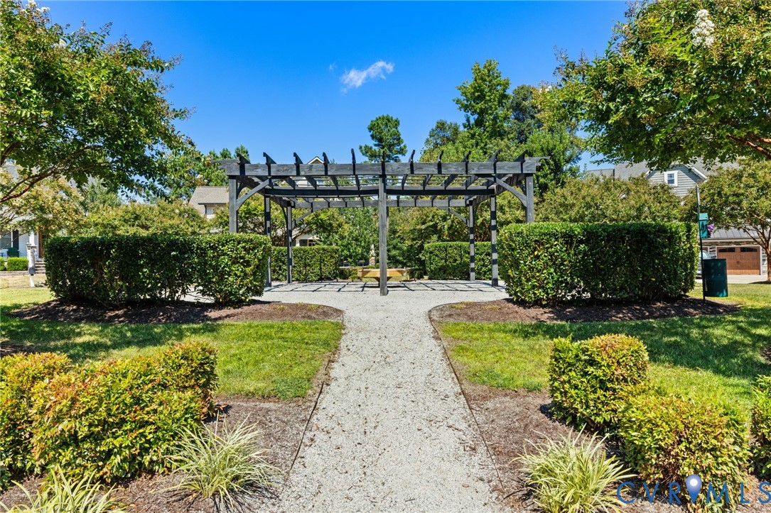 3230 Canford Loop Midlothian, VA 23112 - Photo 39 of 41 a view of a garden with a fountain in the back yard